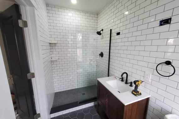 White subway tiles with modern vanity