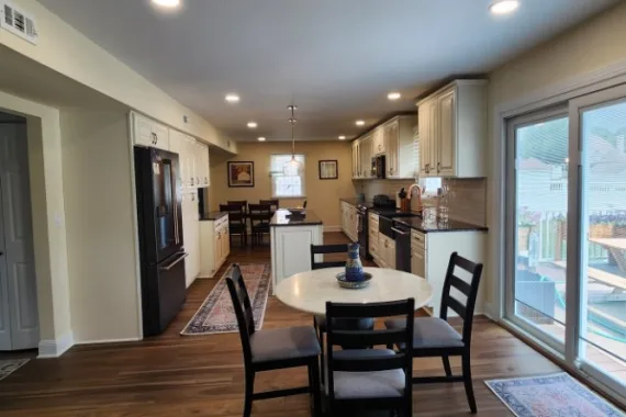 a kitchen with brown cabinets and white counter tops